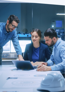 3 people collaborating around laptop