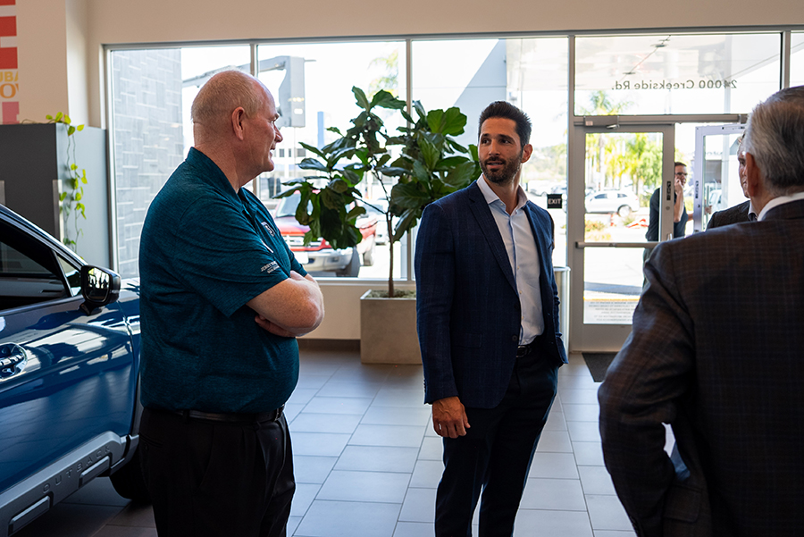 Alex Covino talking to a dealer owner